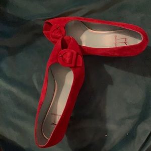 Red suede peek-a-boo shoe.